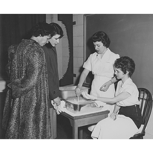 Boston-Bouvé College students demonstrate the use of paraffin during parent's day weekend