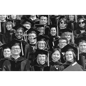 Smiling law school graduates