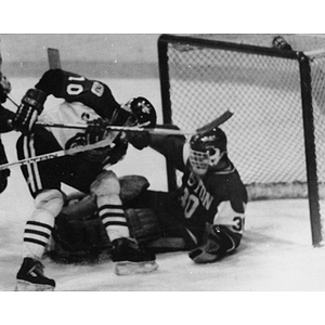 NU men's hockey player, Harry Mews, tries to score at the Beanpot Tournament