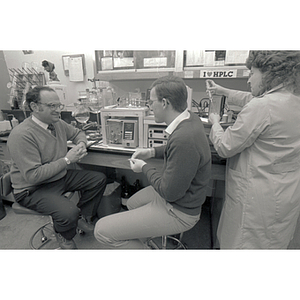 Professor of chemistry, Ira Krull (on the left), with laboratory assistants