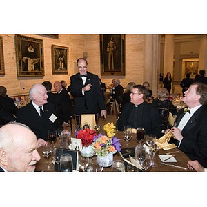 President Aoun stands with a table of guests at his inauguration celebration