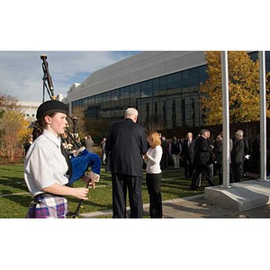 A student plays bagpipes at the Veterans Memorial dedication ceremony