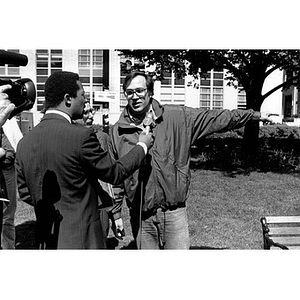 Malcolm Emory speaking to a reporter