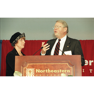 Neal Finnegan speaks at a podium at the Behrakis Health Sciences Center groundbreaking