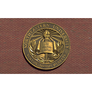 Northeastern University seal on the side of Shillman Hall