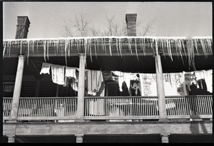 Millers Falls: icicles hanging from the porch of an apartment house, laundry drying on the line