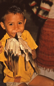 Small boy trying on part of a costume