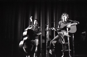 Livingston Taylor in concert: Taylor (acoustic guitar) and Walter Robinson (acoustic bass) -- blurry image