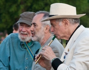 Pete Seeger, Raffi, and David Amram (penny whistle) playing during the Clearwater Festival