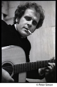 Tim Hardin playing guitar and smoking at the Unicorn Coffee House, Boston, Mass.