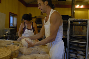 Hungry Ghost Bread: owner and baker Jonathan C. Stevens shaping loaves for baking