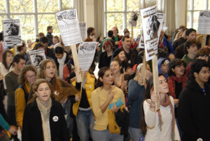 UMass student strike: strikers in the entrance to the Student Union holding signs supporting a general student strike