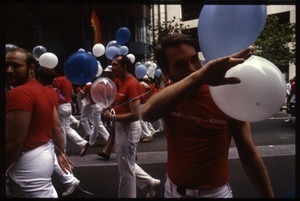 San Francisco Gay Men's Chorus marching with balloons in the San Francisco Pride Parade