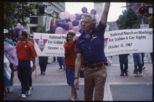 Newly-elected Congressional Representative Nancy Pelosi (red sweater) marching in the San Francisco Pride Parade in front of a banner for the National March on Washington for Lesbian and Gay Rights
