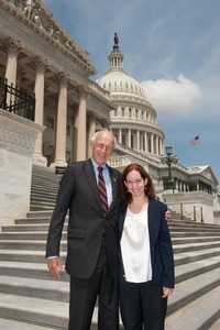 Congressman John W. Olver (center) with unidentified woman, posed on the steps of the United States Capitol building