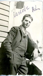 Al Santos posing in suit