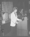 Suffolk University Professor Catherine T. Judge (Law) speaking at the Law Day Dinner event, photograph, 4/21/1979