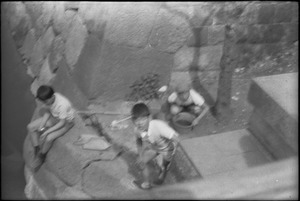 Three boys playing in Tokyo neighborhood