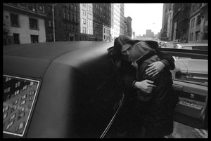 Judy Collins hugging a child by a limousine