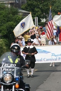 Man in a Puritan outfit leading the Carnival parade : Provincetown Carnival parade