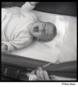 Baby Peter Simon in a crib