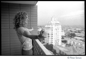 Robert Plant (Led Zeppelin) looks at Sunset Strip from a balcony at the Riot House