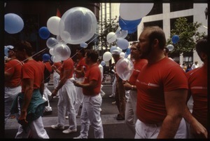 San Francisco Gay Men's Chorus marching with balloons in the San Francisco Pride Parade