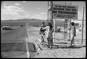 Peace encampment activists talking a security guard at the entrance to the Nevada Test Site