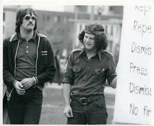 Board of Trustees fee increase demonstration: Charles Bagli holding sign