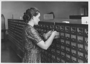 Woman using card catalog in Goodell addition