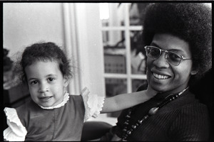 Herbie Hancock with daughter Jessica in lap - Digital Commonwealth