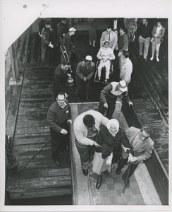 People going up ramp to board ship