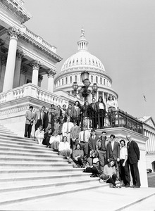 Congressman John W. Olver (right) with visiting group, posed on the steps of the United States Capitol building