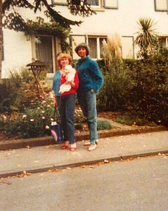 A Photograph of Marlow Monique Dickson Standing on the Sidewalk with a Friend
