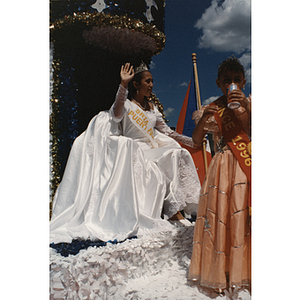 Miss Festival Puertorriqueño, Yaritza Gonzalez, waves from a parade float