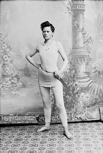 Marie Høeg Wearing a Sweater and Pants with a Sword around the Waist