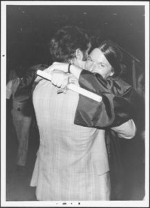 Female graduate hugging another person at the 1978 Suffolk University commencement