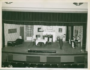 Actors on the stage during a production of a play at Suffolk University's C. Walsh Theatre (55 Temple Street)