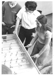 Group of Suffolk University students play foosball in the recreation hall