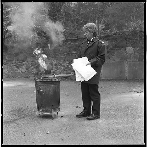 RUC station, Kircubbin, Co. Down. Officer burning confidential papers in bin