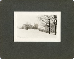 Bapst Library exterior: side view in winter with Saint Mary's Hall, by Clifton Church