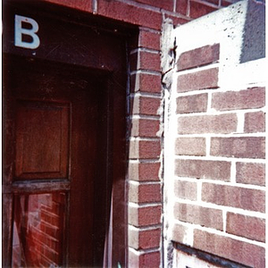 Brickwork surrounding the doorway to a Villa Victoria house.