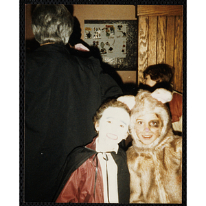 Two children pose in their Halloween costumes