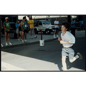 A boy participates in the Battle of Bunker Hill Road Race