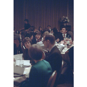 Diners seated a tables during a formal banquet event