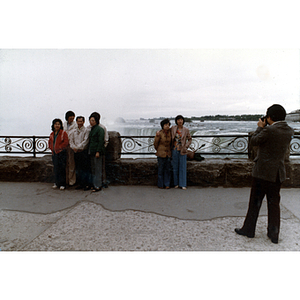 Man photographs of a group of Association members at a Niagara Falls observation deck