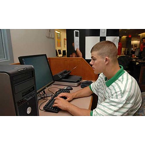 Joseph Bordieri on a computer during the Torch Scholars Scavenger Hunt