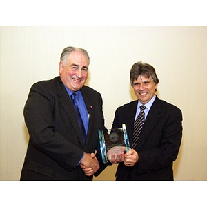 Dr. Ira R. Weiss, right, presenting Harry P. Keegan III, CBA '64, with College of Business Administration's Distinguished Service Award