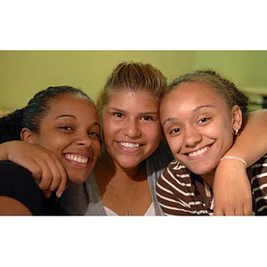 Three female Torch Scholars pose together during their visit to the Exhibition Kitchen