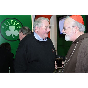 Cardinal O'Malley and Neal Finnegan talking at the Beanpot Reception